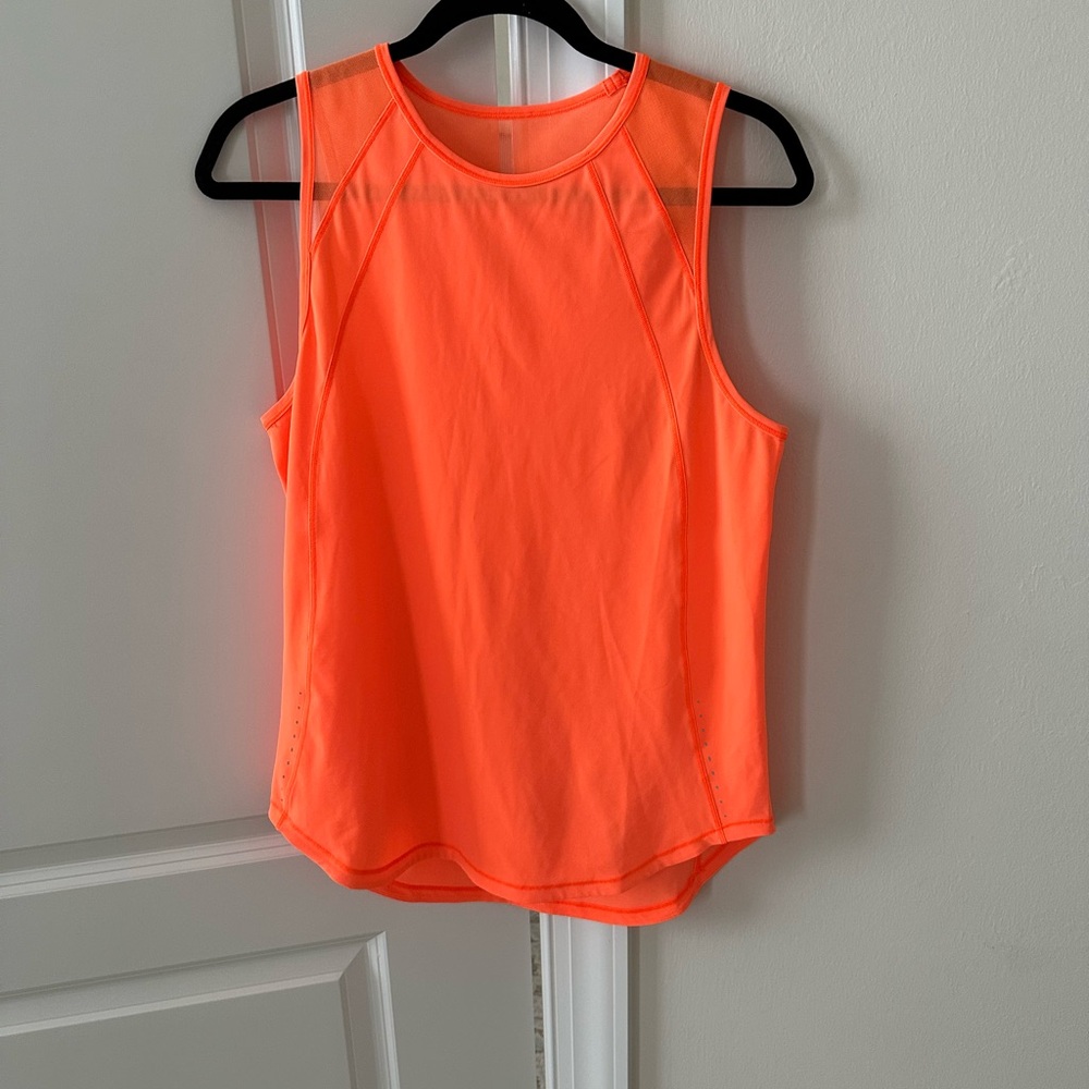 Women’s Lululemon Sculpt orange top good condition. Hardly worn. Size M